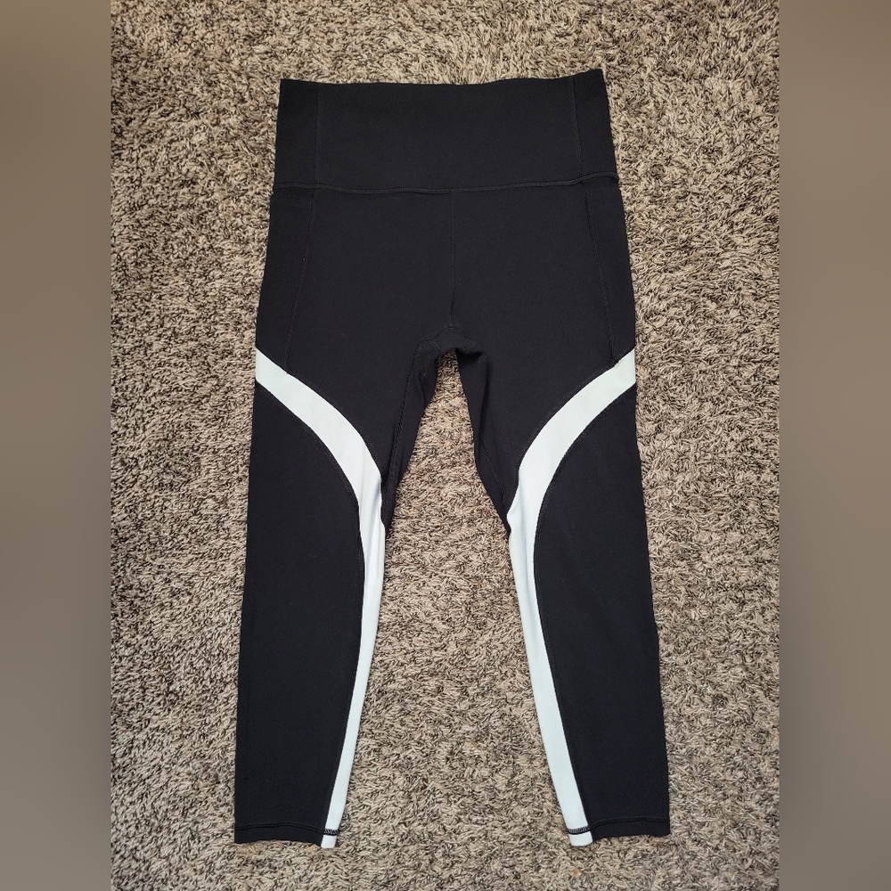 athleta salutation stash pocket 7/8 tight leggings medium